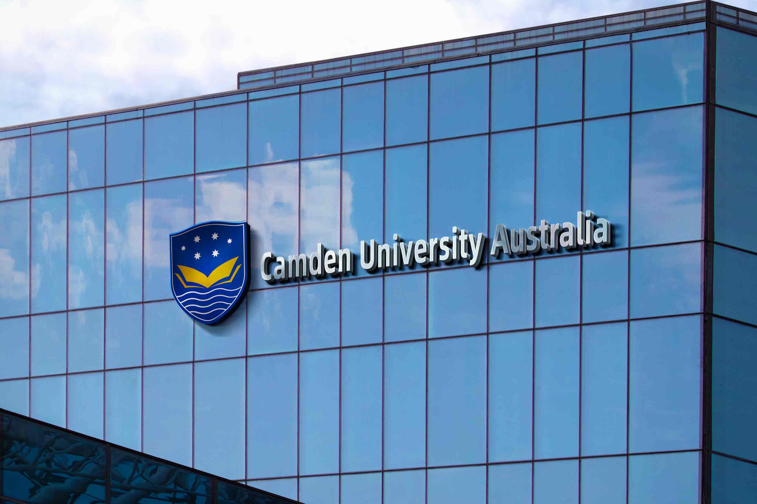 View looking up at CUA campus buildings with CUA Tower in the background